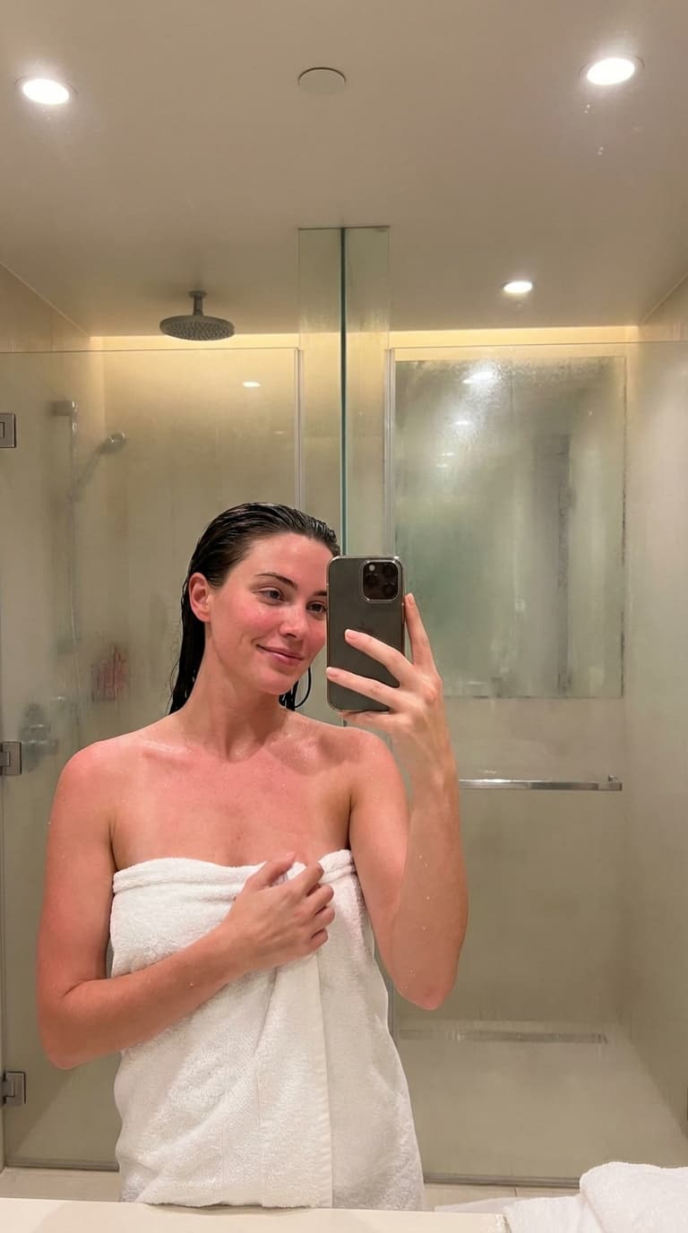 Post-shower bathroom selfie in a towel
